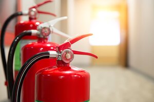 restoration company helping to prevent commercial fire damage by providing fire extinguishers 